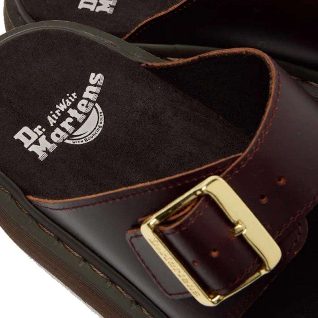 Close-up of the Dr Martens Josef Charro Atlas Slide Sandal Leather in dark brown, showcasing a gold buckle and a visible white logo on the black cushioned insole., 52357, 190665783841, 190665783858, 190665783872, 190665783889, 190665783896, 52363, 52364