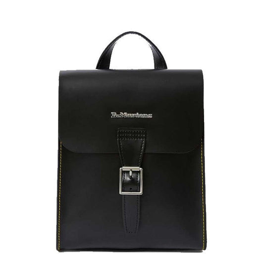 Image of right foot, side on of Dr Martens Mini Leather Backpack Black-Foot Forward Shoes