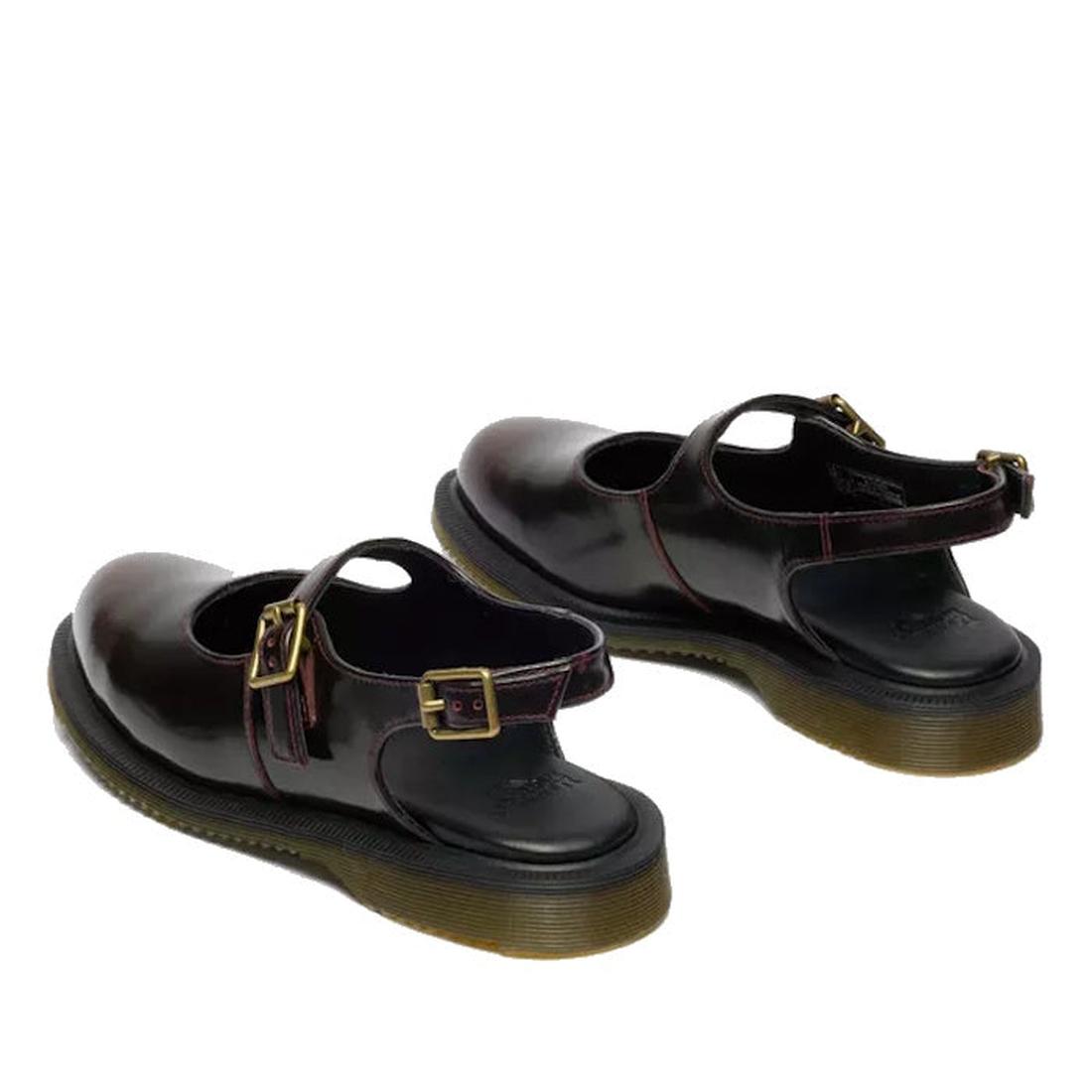 A pair of Dr Martens Madaline Cherry Red Arcadia Women’s Slingback Mary Jane Shoes with chunky black Goodyear Welted soles, gold buckle straps, and polished leather are displayed facing away on a white background., 52343, 190665775976, 190665775983, 19066