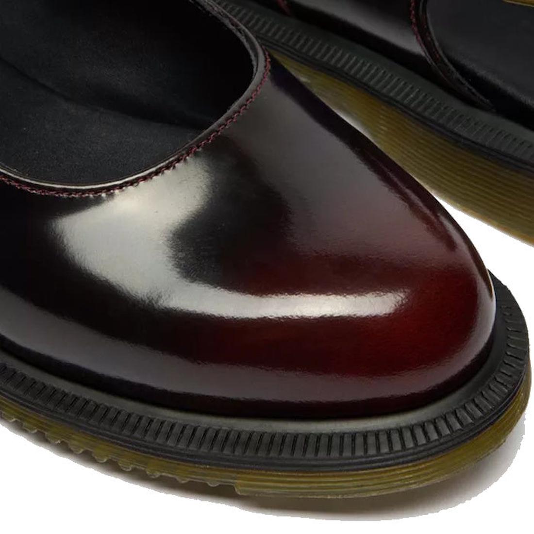 Close-up of Dr Martens Madaline Cherry Red Arcadia Women's Slingback Mary Jane Shoes with polished smooth leather, rounded toes, black cushioned insoles, contrasting stitching, and thick black soles with yellow-brown Goodyear welted edges., 52343, 1906657