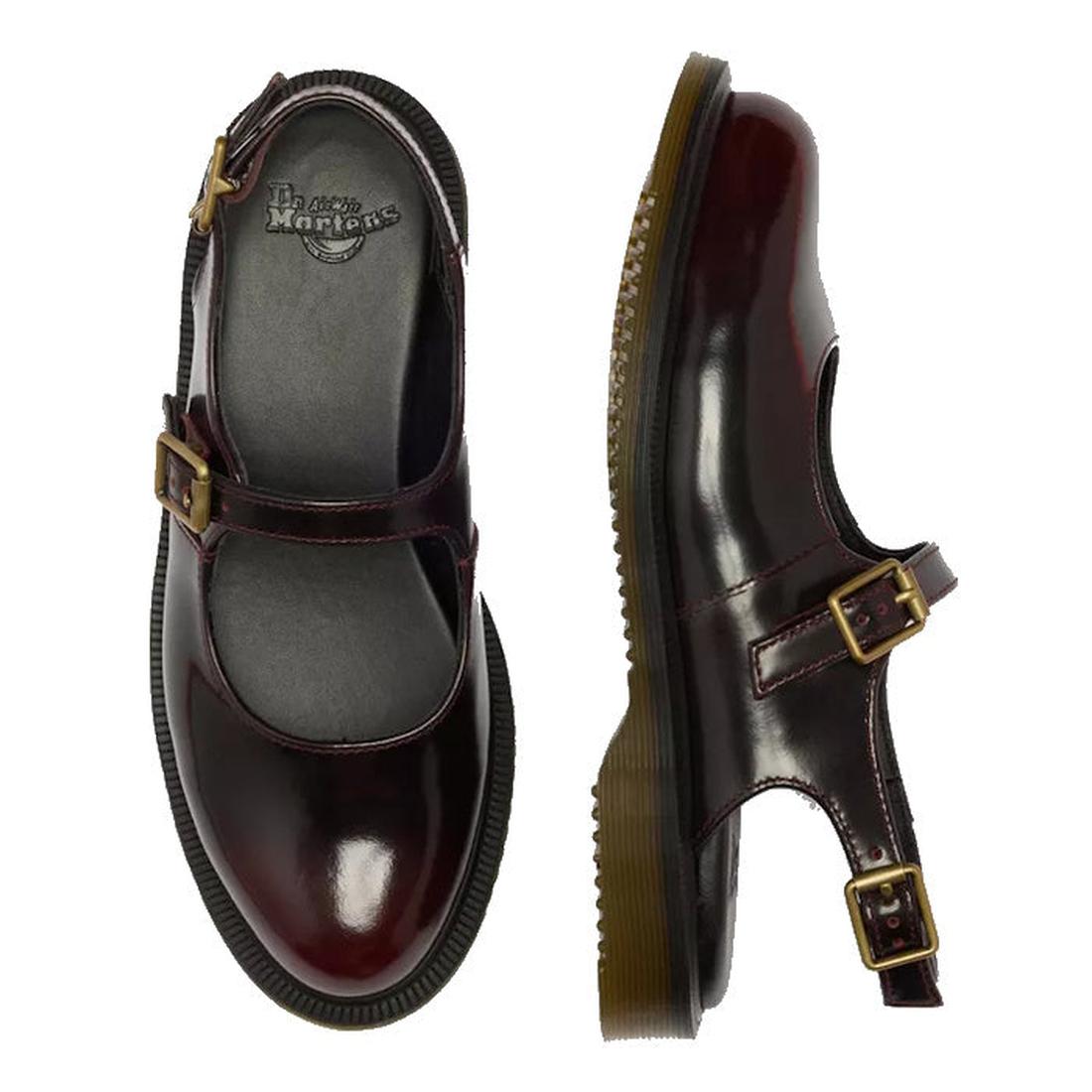 A pair of Dr Martens Madaline Cherry Red Arcadia Womens Slingback Mary Jane Shoes in polished leather with gold buckles and thick translucent rubber soles. One shoe is shown from the top, one from the side; both feature Goodyear welted construction., 5234