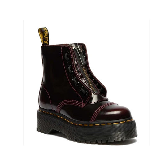 The Dr Martens Sinclair Cherry Red Boot has glossy cherry leather, a sturdy black sole, yellow stitching, zipper, and fun laces.  ksnz