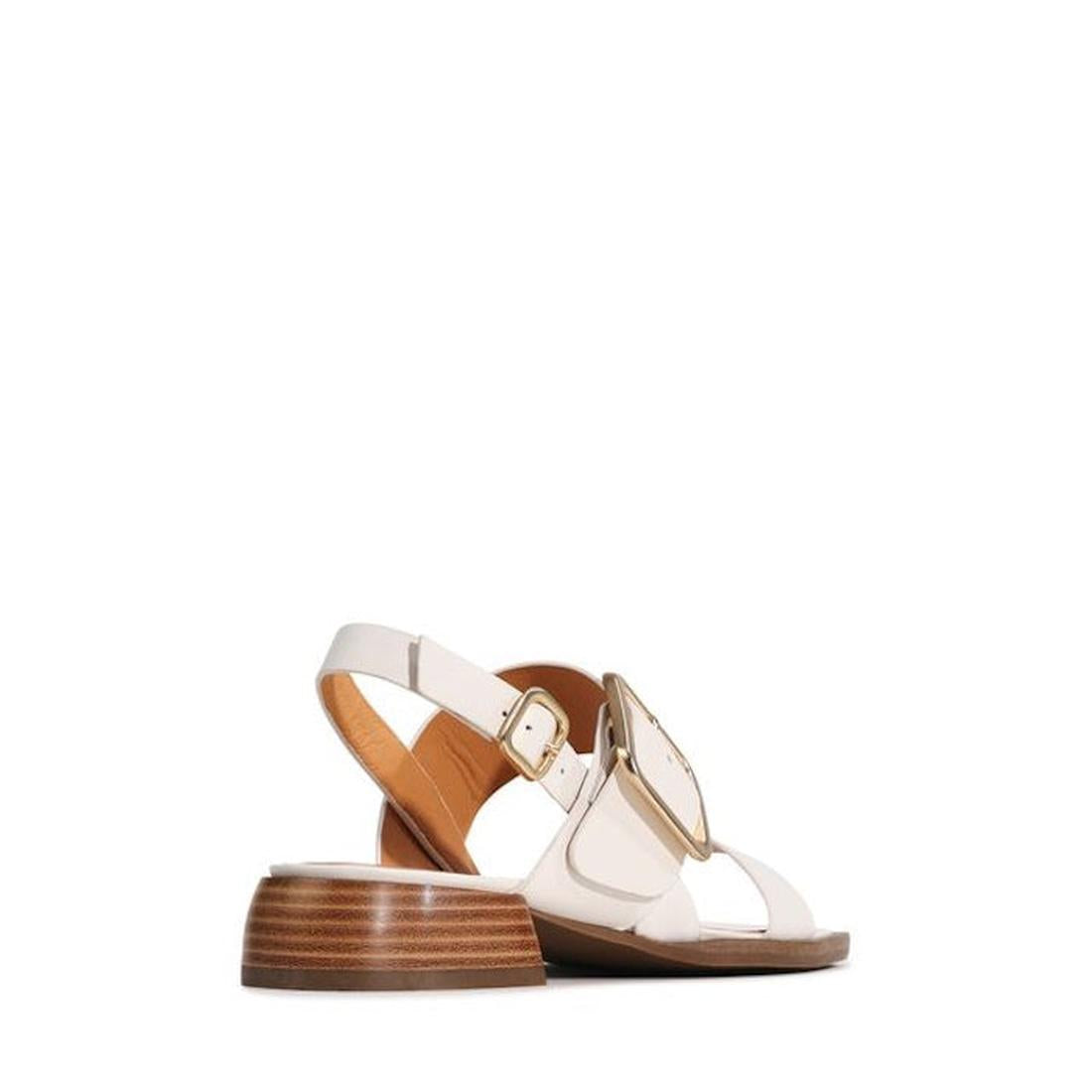 The EOS Ikam Womens Bone Leather Low Heeled Sandal w/Back Strap features a square toe, cream leather, low wooden heel, large gold buckle, and slingback strap shown from the rear on a plain white background., 9321191304984, 9321191304991, 9321191305004, 93