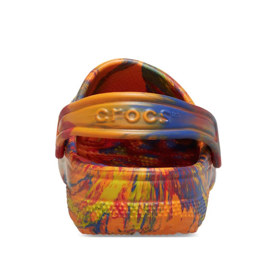 A back view of the Crocs Kids - Marbled Clog Sandal Orange Zing Youths in a vibrant tie-dye blend of orange, yellow, blue, and red. The heel strap with the Crocs logo is up on these colorful marbled kids clogs., 198445271571, 198445271588, 198445271595, 1