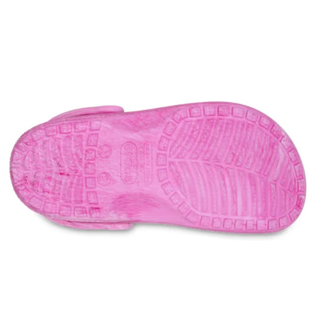 The image shows the underside of the Crocs Kids - Watercoloured Marbled Clog Sandal Pink Swirl Youths, featuring a Croslite foam sole with textured grip patterns, raised symbols, and rectangular tread designs., 198445279645, 198445279652, 198445279669, 19