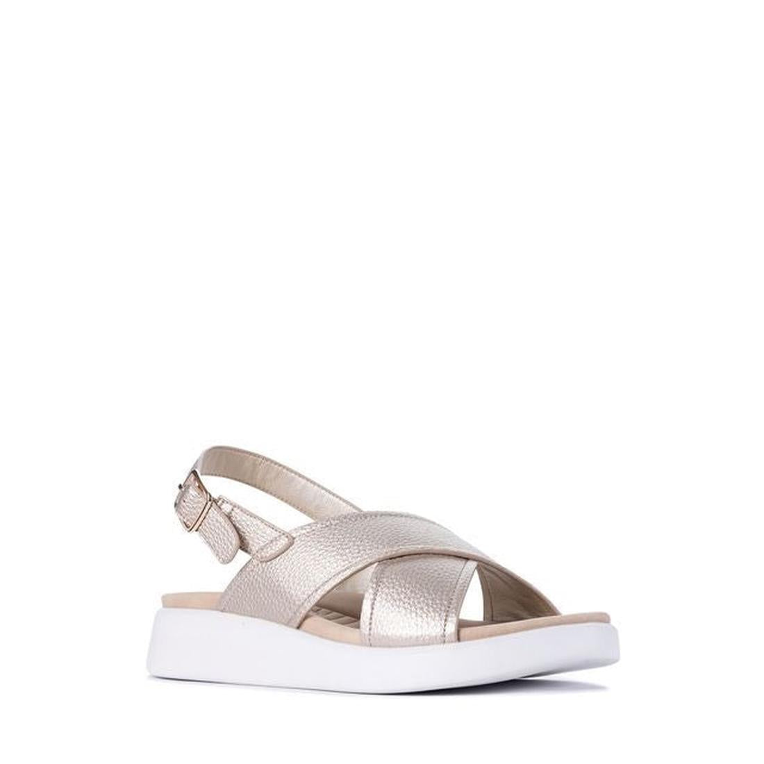 The Los Cabos Bogota Gold Womens Summer Sandal features vegan leather crisscross straps, an open toe, adjustable back strap, and a thick white sole—combining comfort and style in metallic gold.
