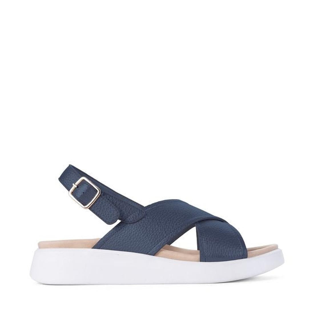 Los Cabos Bogota Navy Women’s Sandal, with soft navy straps, adjustable buckle, and comfy white sole, shown from the side.  ksnz