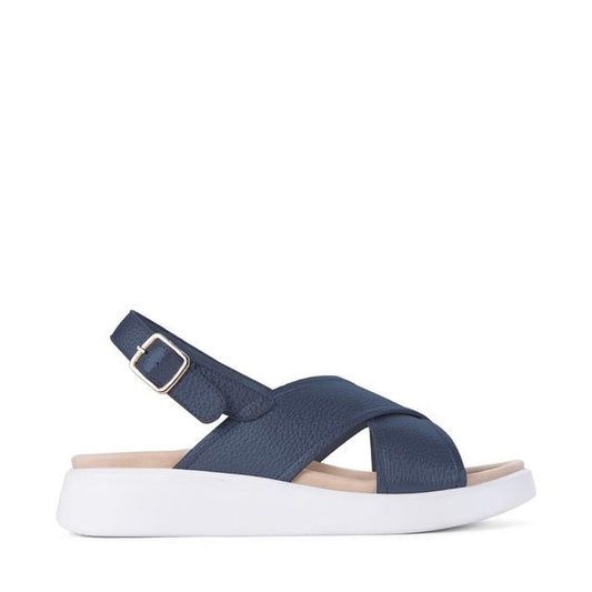 Los Cabos Bogota Navy Women’s Sandal, with soft navy straps, adjustable buckle, and comfy white sole, shown from the side.  ksnz
