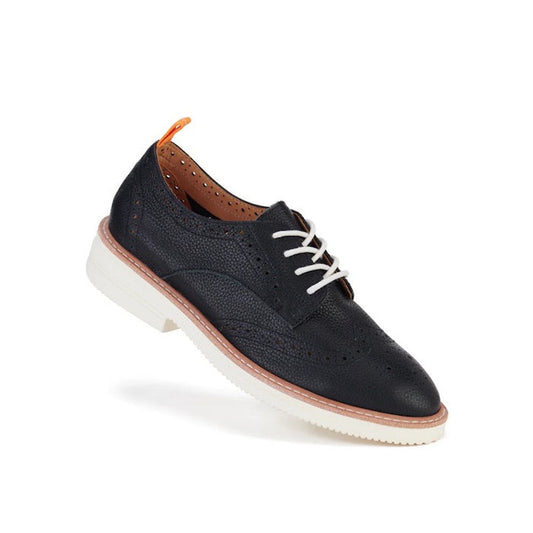 Rollie Womens Derby Brogue Rise is a comfy black leather lace-up, with white Vibram sole, tan midsole, and orange heel tab.  ksnz