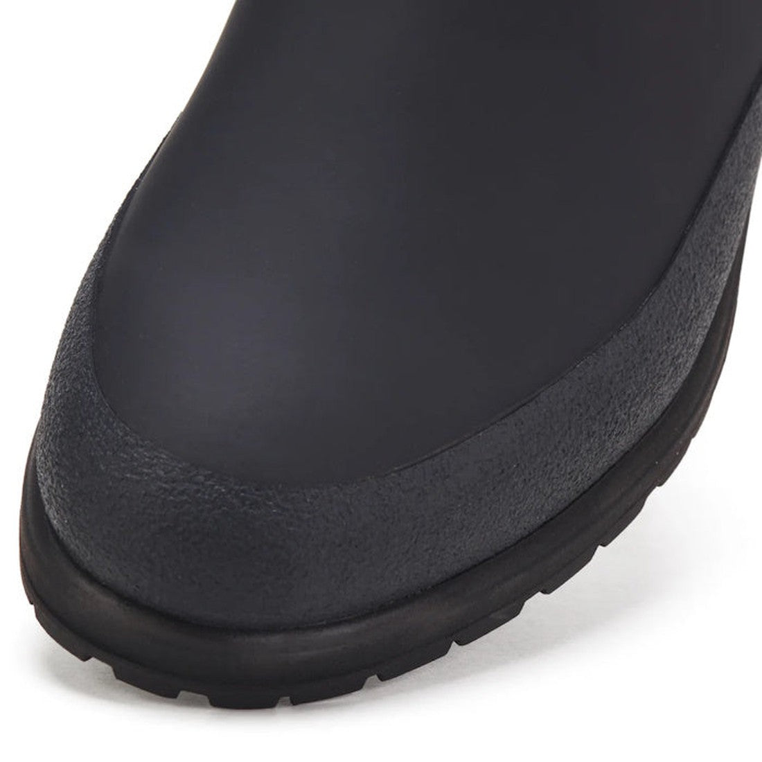 Up-close view of the Rollie Womens Fields Chelsea Waterproof Black Leather Boot, with secure elastic sides, sturdy sole, and textured tread.  ksnz