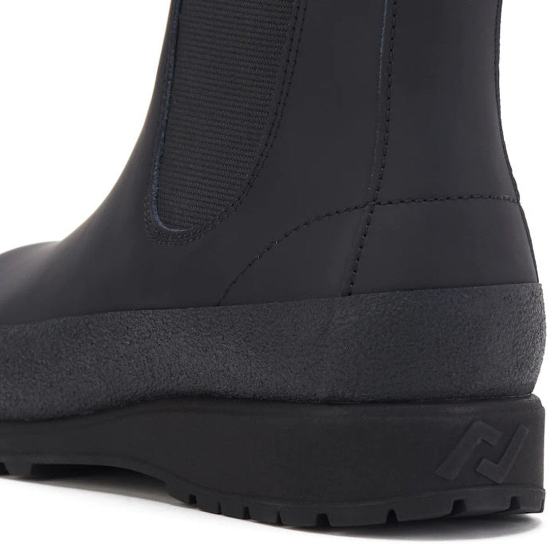 Rollie Womens Fields Chelsea Waterproof Black Leather Boot with easy slip-on style, sturdy textured sole, and embossed heel logo.  ksnz