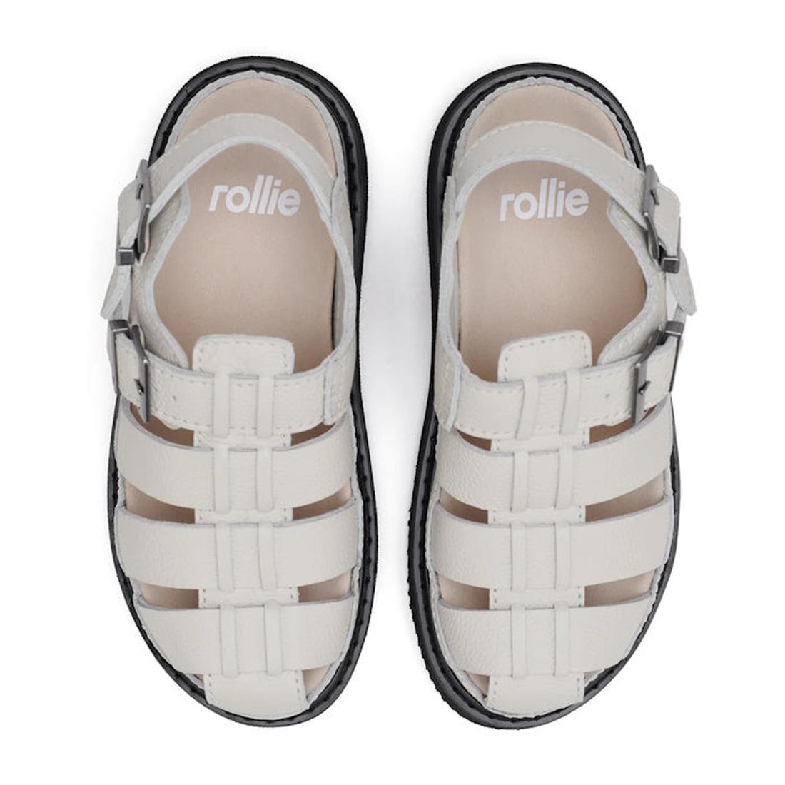 Top down view of a pair of Rollie Hyde Fisherman sandals with 4 horizontal straps over the foot and one strap wovne verically from the toe to the top of the foot. Buckle adjustment at the heel and also over the top of the foot, a beige footbed and black s