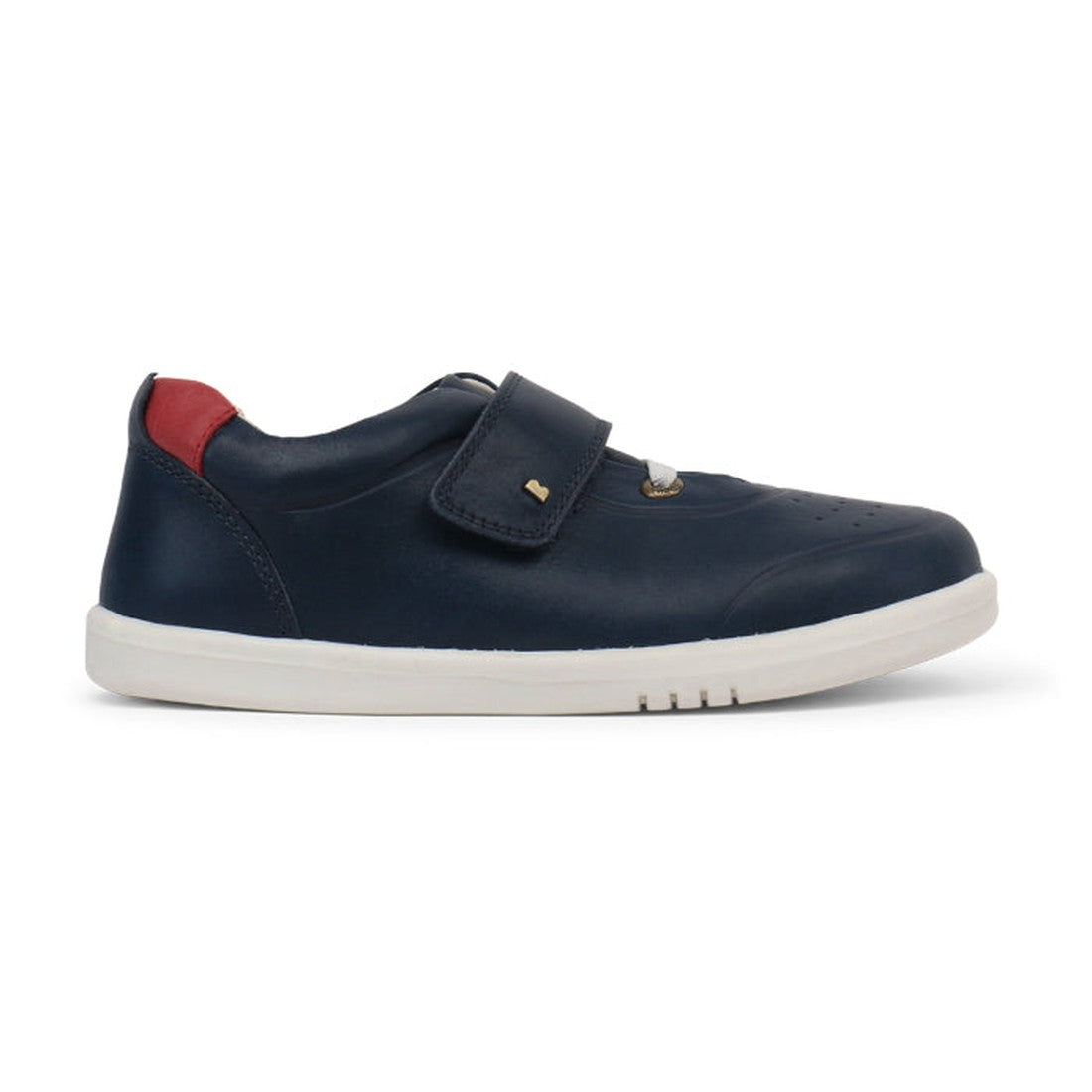 The Bobux Kids + Plus Ryder Navy Velcro Trainers 835602 feature a navy design with a white sole, red heel accent, and a single velcro strap, making them easy for kids to fasten., 9420062043059, 9420062043066, 9420062043073, 9420062043080, 9420062043097, 9