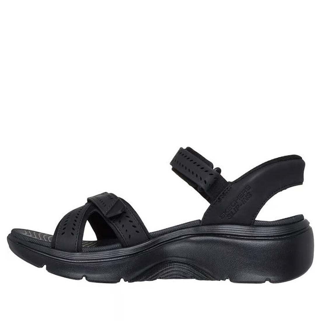 The Skechers Women's Go Walk Arch Fit 2.0 SLIP-INS Candace Black Sandal features an open toe, two adjustable straps, ankle strap, cushioned sole, slight heel, textured details, is vegan-friendly, and has received the APMA Seal of Acceptance., 49057, 19873