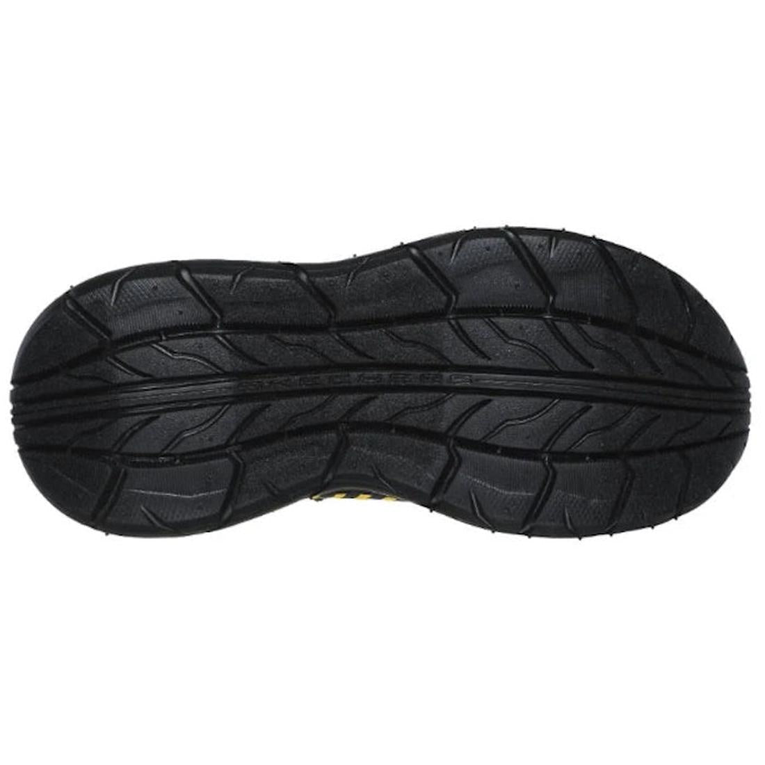 The image shows the black rubber outsole of the Skechers Kids Skech Tracks Charcoal Yellow Tuff Truck Trainer with a wavy tread for grip and traction, plus a cushioned insole for all-day comfort., 197627197722, 197627197746, 197627197760, 197627197784, 19