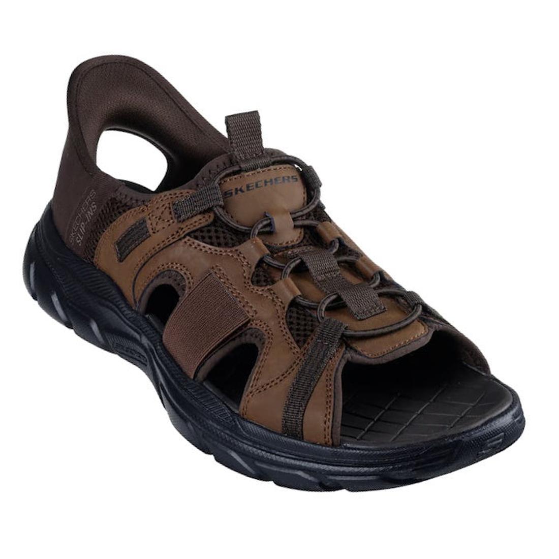 The Skechers Mens Revolted SS Merrick Slip In Sandals in Dark Brown feature a brown and black open-toe design, comfort footbed, rugged rubber sole, mesh accents, adjustable laces, and display the Skechers logo on the upper strap for outdoor use.