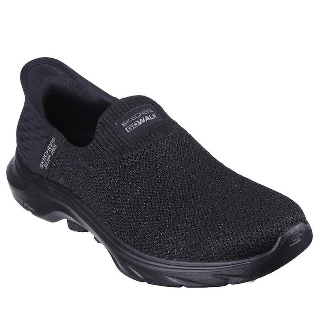 The Skechers Womens Slip In Go Walk 7 Springtime Black is a slip-on with a knitted mesh upper, cushioned sole, low heel, Air-Cooled Memory Foam for comfort, and Skechers logos on the top and side.