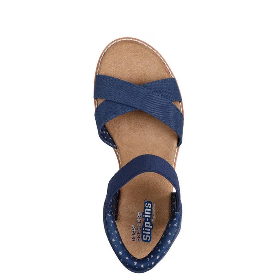 A top view of the navy Skechers Womens Bobs Desert Kiss Golden Lily SLIP IN sandal, featuring crisscross fabric straps and a cushioned tan insole. The heel area displays a dotted pattern for enhanced Memory Foam comfort., 49030, 198739558746, 198739558760
