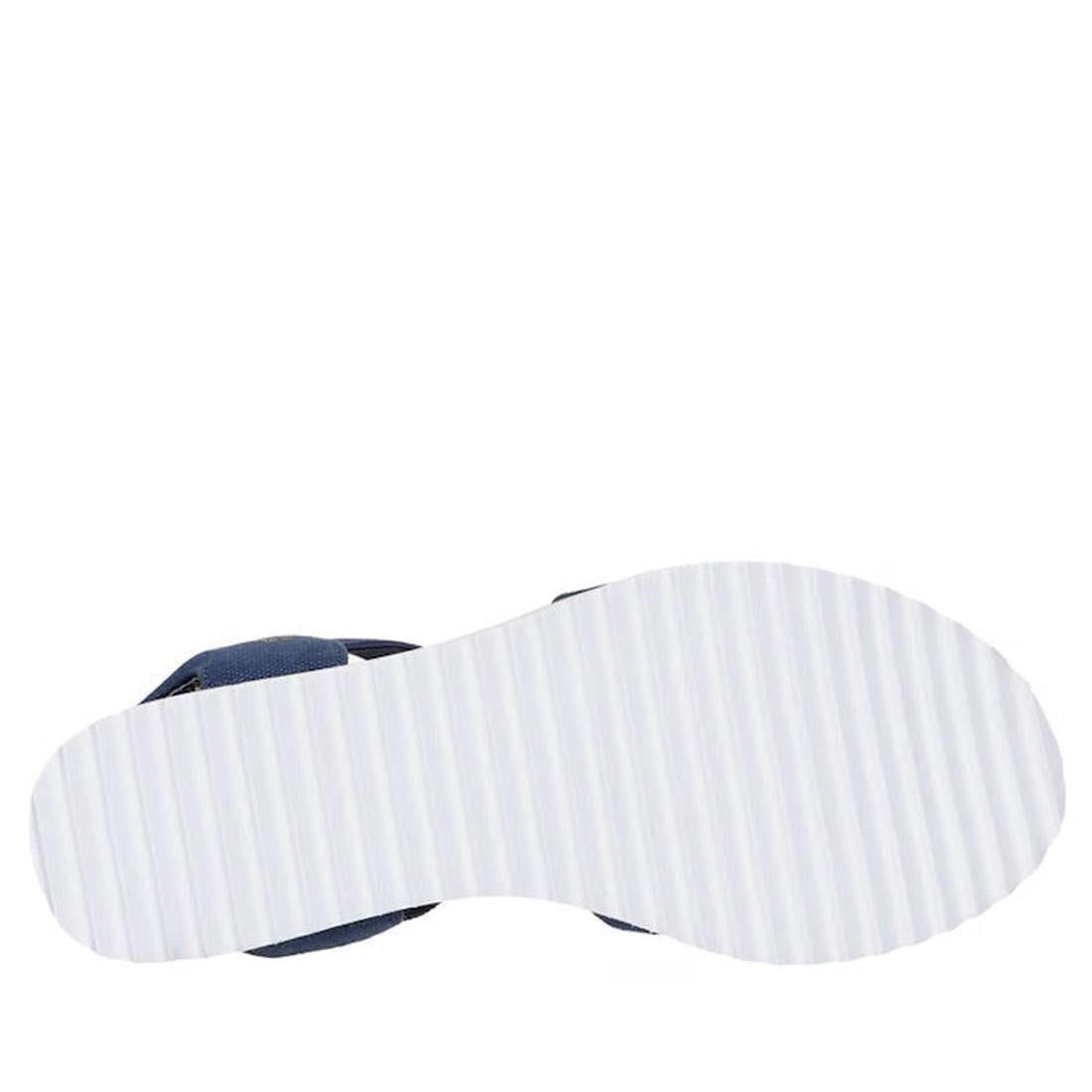 The image shows the bottom view of the Skechers Womens Bobs Desert Kiss Golden Lily Navy SLIP IN with a white, ridged sole featuring evenly spaced horizontal grooves for grip and a dark upper part visible at the heel., 49030, 198739558746, 198739558760, 1