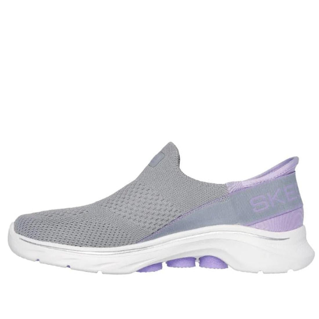 The Skechers Womens Slip-Ins GO WALK 7 Mia in Grey Lavender features a breathable mesh upper, Air-Cooled Memory Foam insole, white sole, light purple accents, and Skechers branding on the heel., 38371, 38372, 197627364025, 197627364032, 197627364049, 1976