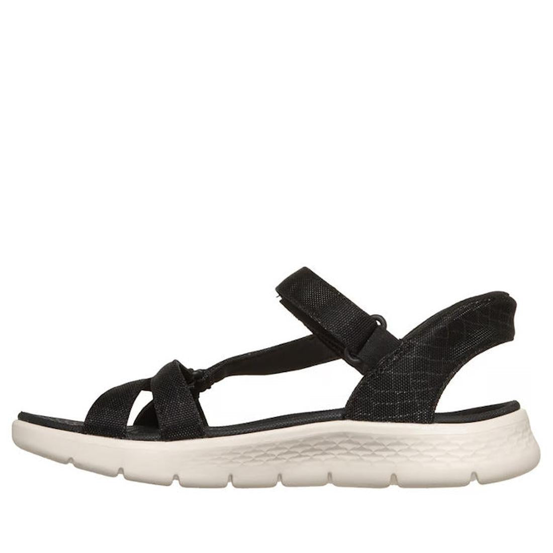 The Skechers Womens Slip Ins Sandals Go Walk Flex Sssophia Black is a black open-toe sandal with adjustable straps and a thick white textured sole, displayed in side profile on a white background., 198376904128, 198376904135, 198376904142, 198376904159, 4