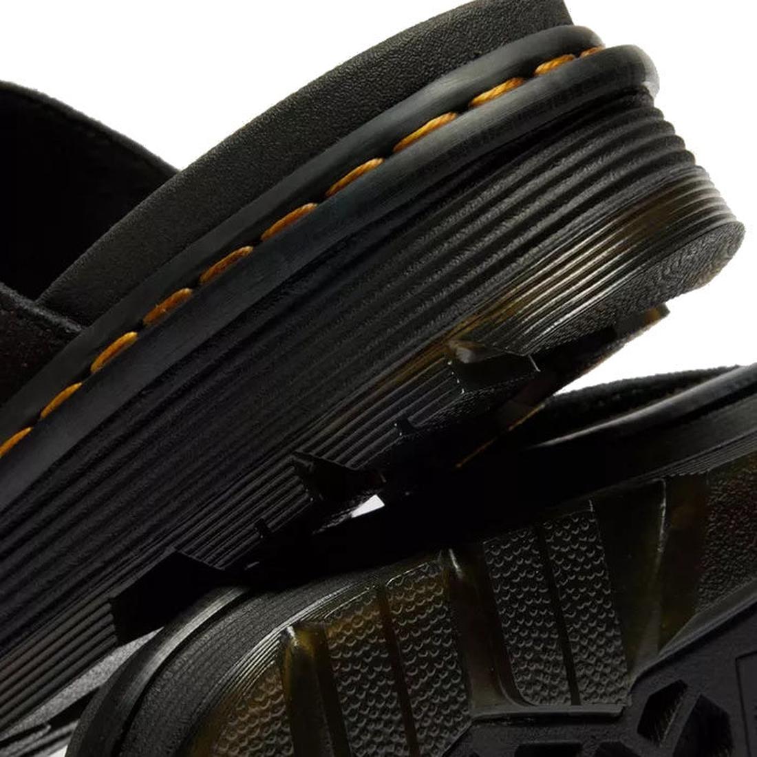 Close-up of Dr Martens Zebzag Black EH Suede Slide Sandal featuring detailed yellow stitching, textured rubber soles, a ribbed heel, and sturdy air-cushioned sole construction that highlights expert craftsmanship., 190665790689, 190665790696, 190665790702