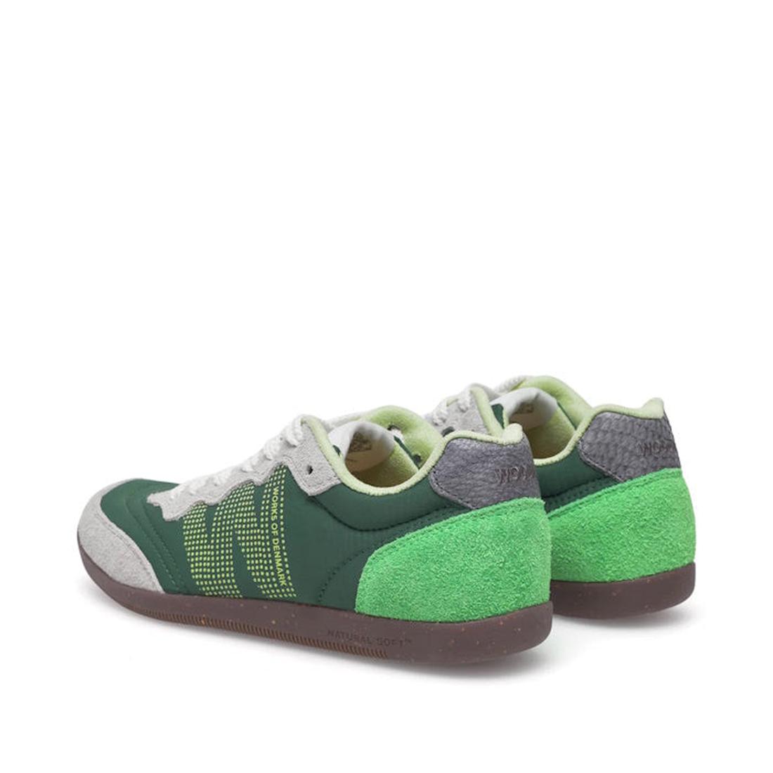 The Woden Nanna Apple Green Multi Lace Up Sneaker features green suede heels, dark green panels, gray accents, white laces, and yellow dotted side detailing, shown from a rear side angle on a white background., 50250, 5713326697834, 5713326697841, 5713326