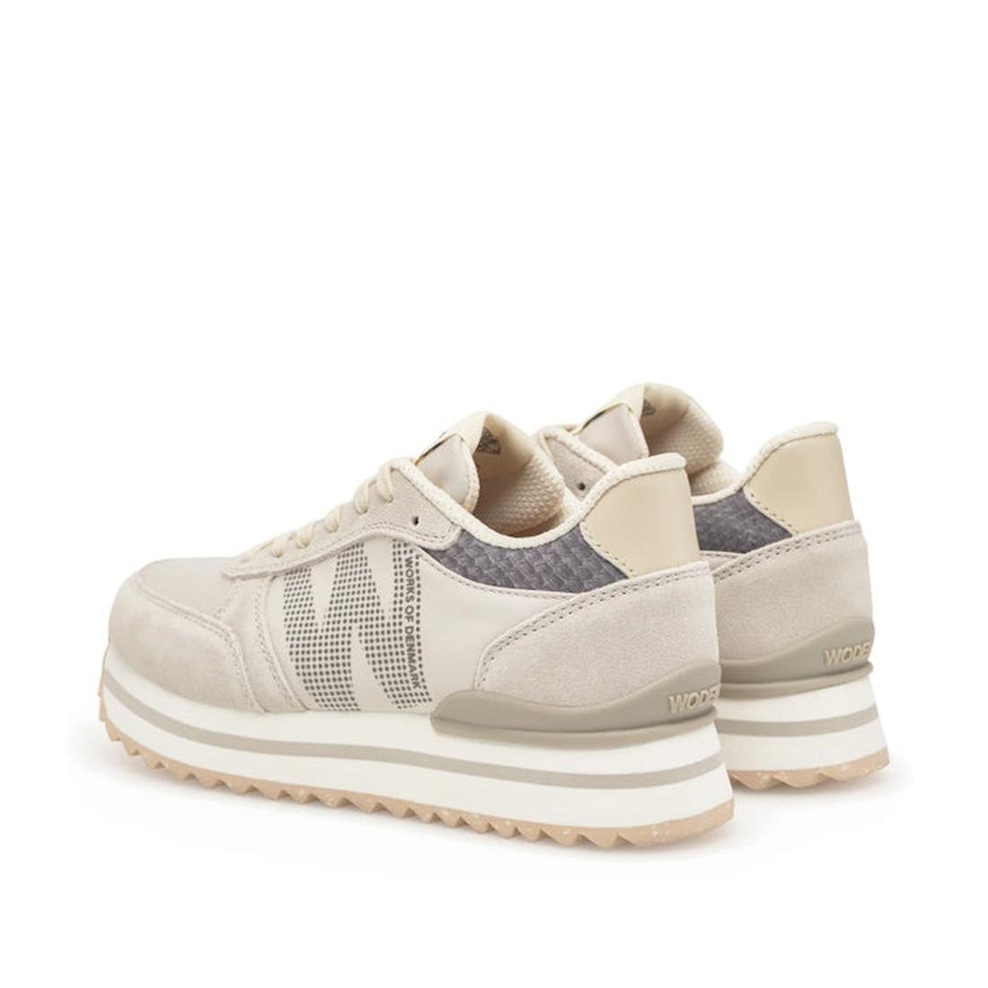 The Woden Ronja Plateau Delpin Lace Up Sneaker features beige and cream suede and mesh panels, white laces, chunky white soles, and subtle fish leather accents. The pair is shown angled to display both the sides and backs., 5713326692365, 5713326692372, 5
