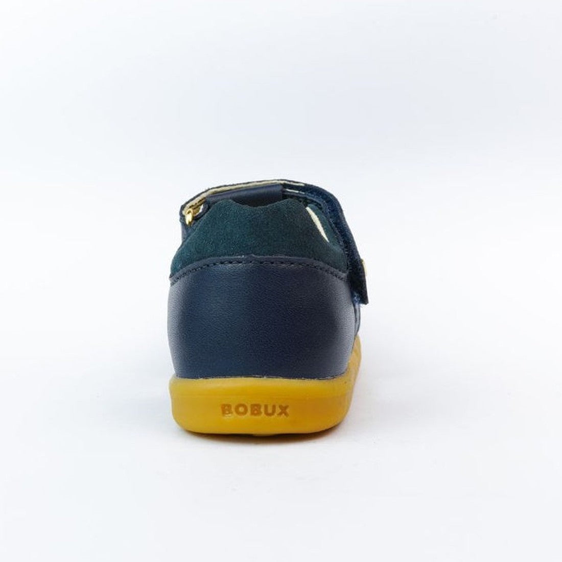 The Bobux iWalk Cross Jump Sandal Navy Closed Toe 636703 is shown from the back, with a navy leather upper, yellow sole featuring BOBUX branding, and set against a white background., 9420062083604, 9420062083611, 9420062083628, 9420062083635, 942006208364