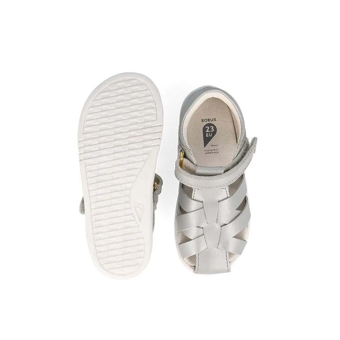 The Bobux Iwalk IW Tropicana II Metallic Silver Sandal 638320 in size 23 EU features a white textured sole and a closed-toe woven quick-dry leather design with a Velcro strap—ideal summer shoes for kids., 9420075776517, 9420075781092, 9420075776210, 94200