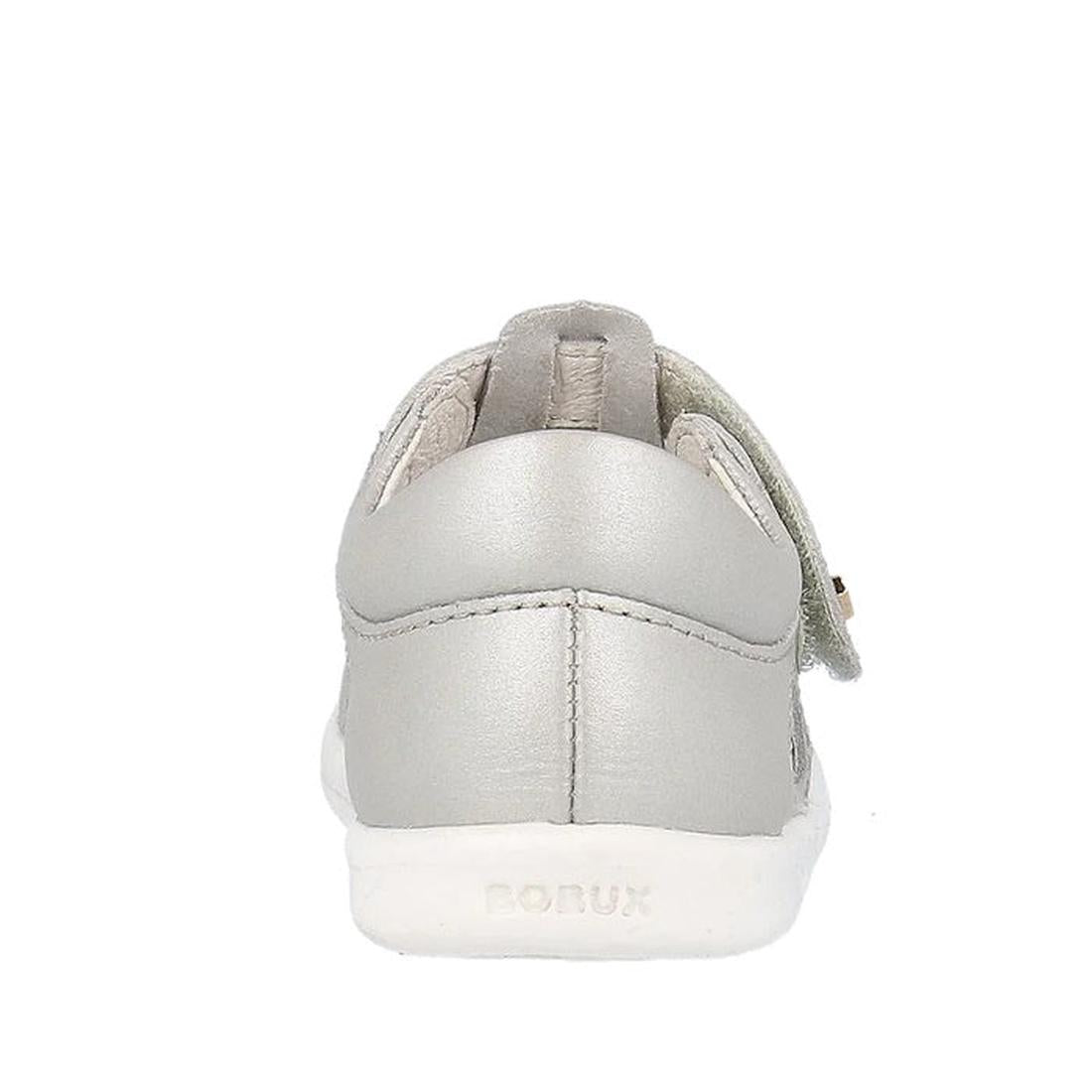 The Bobux IWalk IW Zap II Sandal in Metallic Silver is shown from the back, featuring a white sole with "PONUX" on the heel, smooth quick-dry leather, and a small Velcro top strap., 9420075777460, 9420075777675, 9420075781054, 9420075780002, 9420075778702