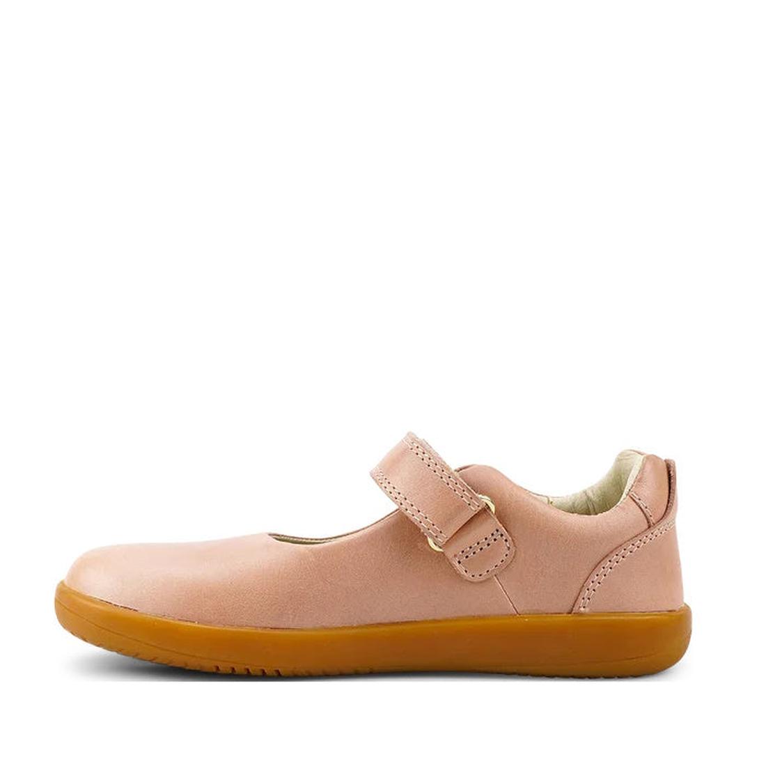 The Bobux Kid+ Delight Mary Jane Dusk Pink 831625Z is a single pink leather Mary Jane shoe with a Velcro strap and light brown sole, shown in profile on a white background—perfect for girls’ classic or school shoe needs., 9420075719187, 9420075719194, 942