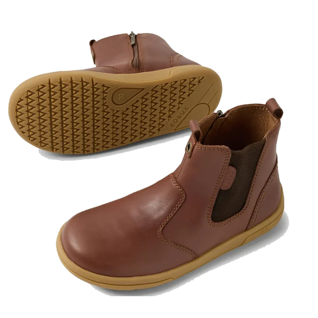The Bobux KP Kids Plus Jodhpur 2 II Juniors Leather Boot in Toffee features a brown leather upper, tan flexible textured soles, side zippers, and elastic panels. One boot is upright to show front and side; the other shows the sole., 52162, 52163, 52164, 5