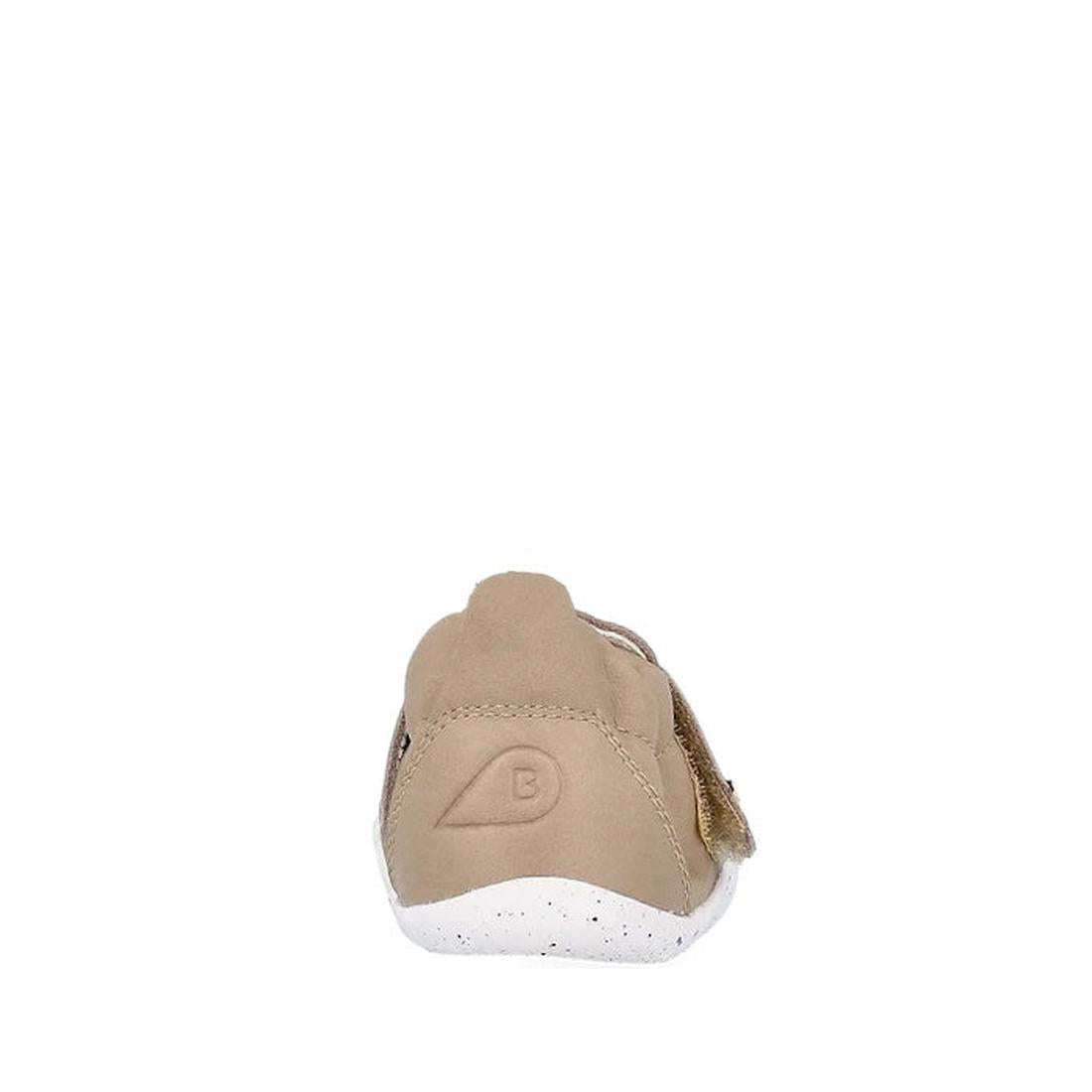 The Bobux XP Explorer Beau First Walker Sandal Atmosphere 502301 is a tan shoe seen from the back, with a white speckled flexible sole, embossed B logo on the heel, and a smooth, simple design., 9420075784338, 9420075783690, 9420075786172, 9420075784239