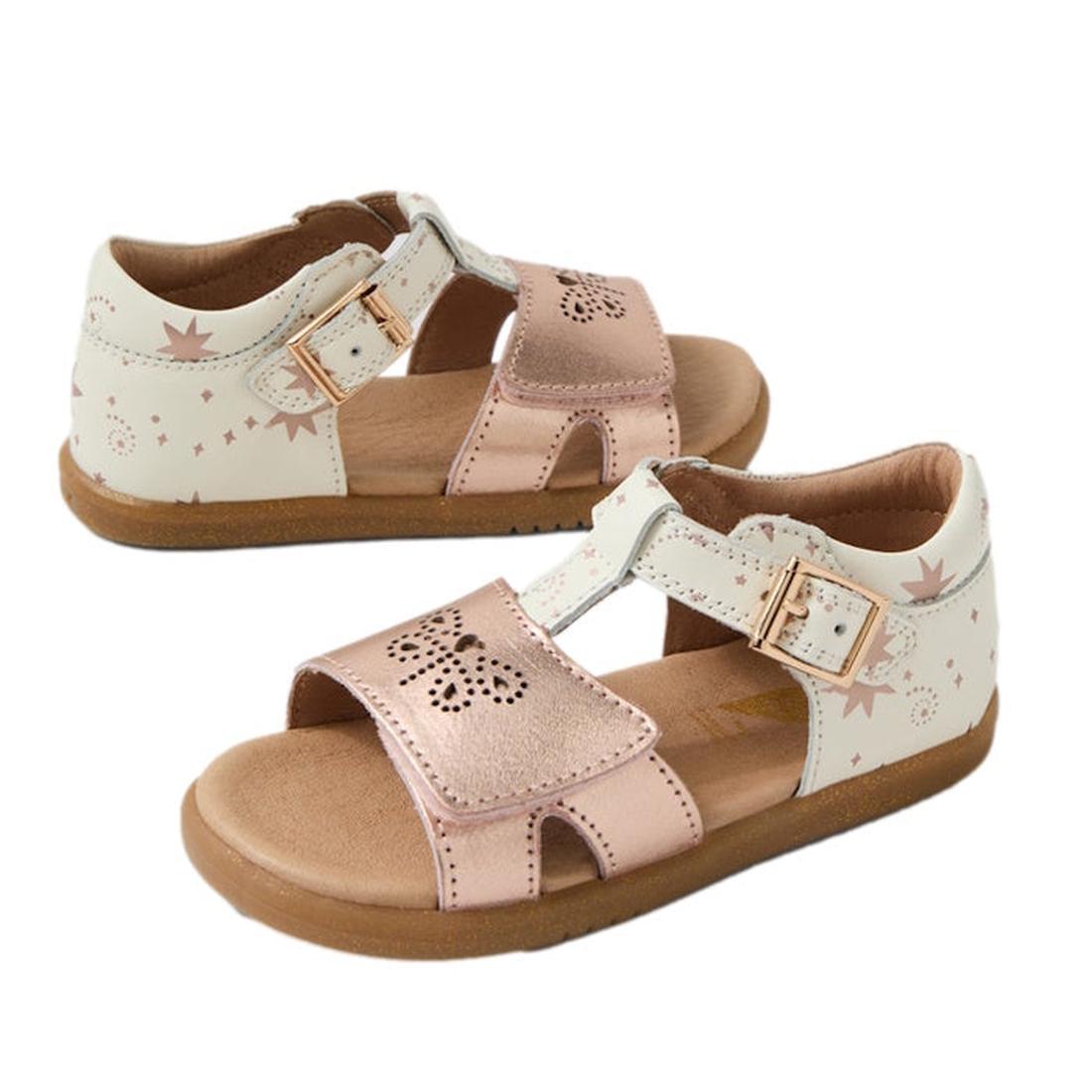 The Bobux IW Iwalk Haven White Rose Gold Open Toe Sandal features a pink and white design with star patterns, a perforated butterfly front, adjustable buckled straps, and brown flexible soles, displayed on a white background., 9420074865779, 9420074865786