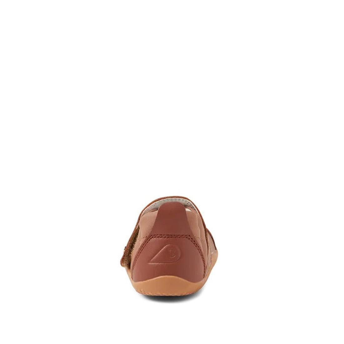 The Bobux XP Explorer Breeze First Walker Sandal Brown 502407 is shown from the back against a white background, featuring a visible Velcro strap on the side and a flexible sole ideal for first walkers., 9420075761438, 9420075762749, 9420075762725, 942007