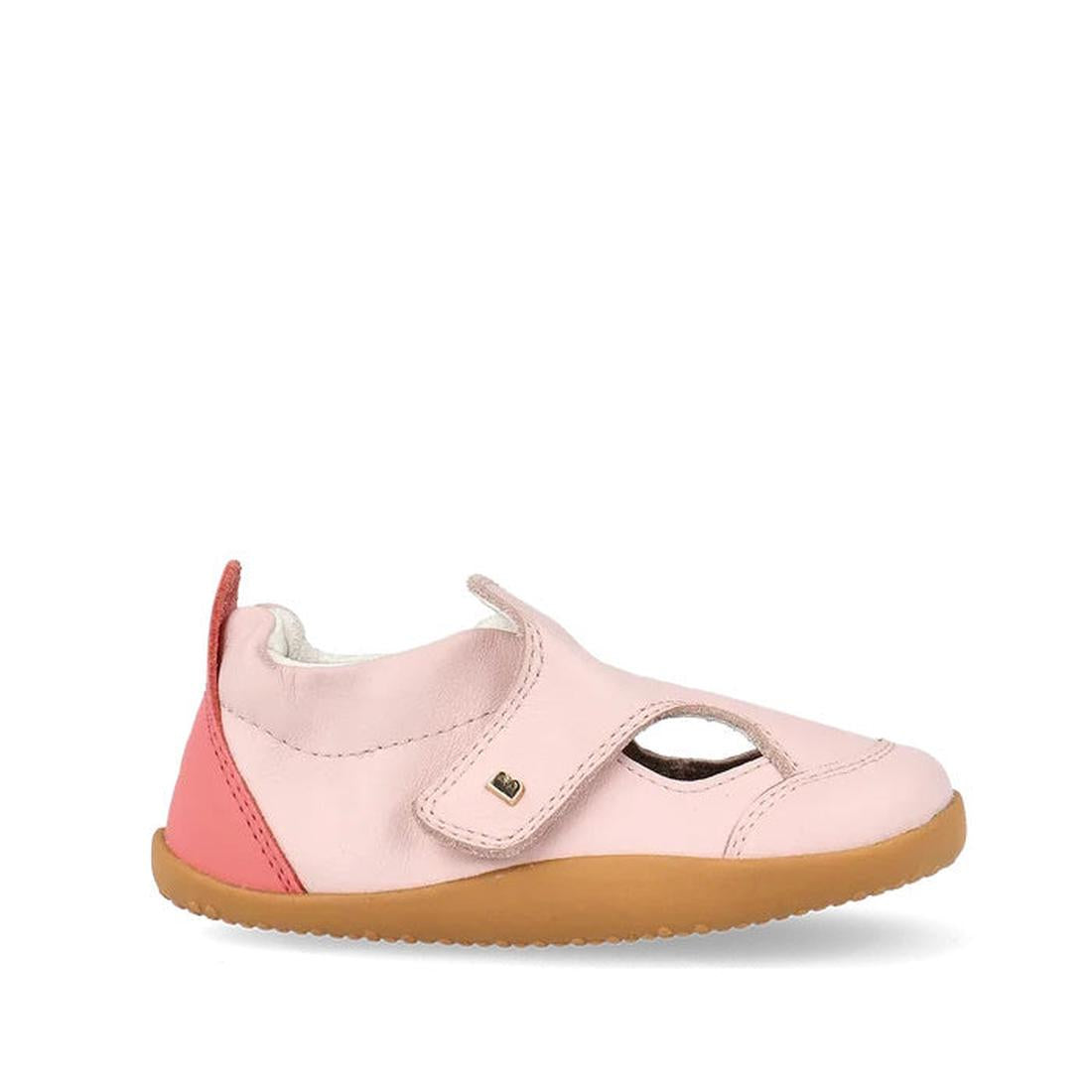 The Bobux XP Explorer Breeze First Walker Sandal in Rose Water Pink (502405) features a tan rubber sole, velcro strap, pink heel accent, and side cut-outs—offering comfort and flexibility for toddlers taking their first steps., 9420075784864, 942007578600