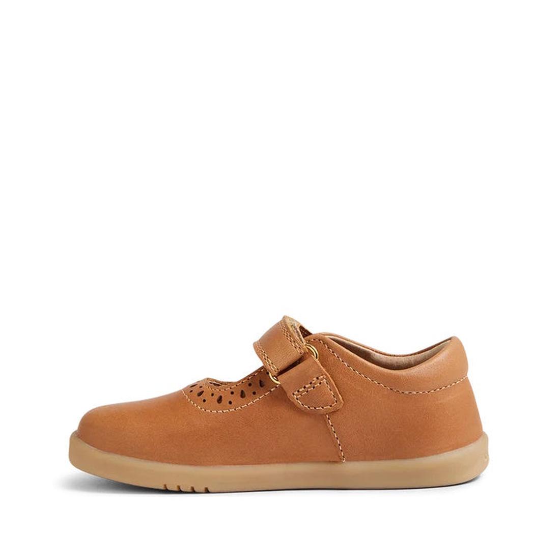 The Bobux Iwalk Lola Toddlers Mary Jane Caramel Tan Leather 652801 is a kids' leather shoe with a flexible rubber sole, toe perforations, and an adjustable hook-and-loop strap, shown from the side on a white background., 9420068549531, 9420068549548, 9420