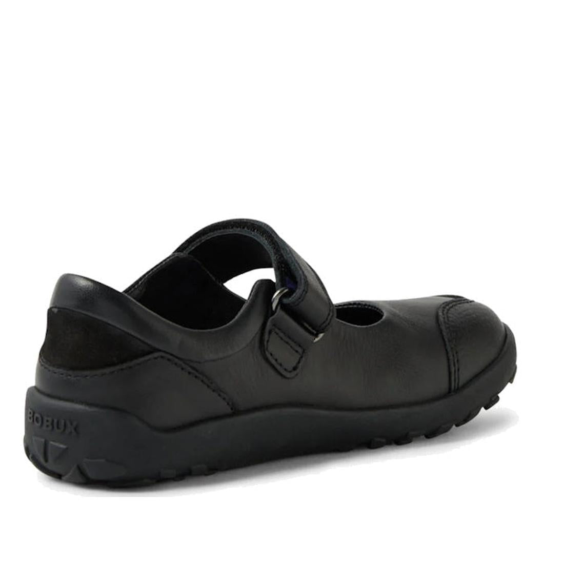The Bobux Kid+ Hula Alpha Black School Leather Mary Jane Shoe features a black leather upper, velcro strap, rubber sole, and closed toe. Shown from a rear side angle on a plain white background., 48430, 9420074842237, 9420074842244, 9420074842251, 9420074