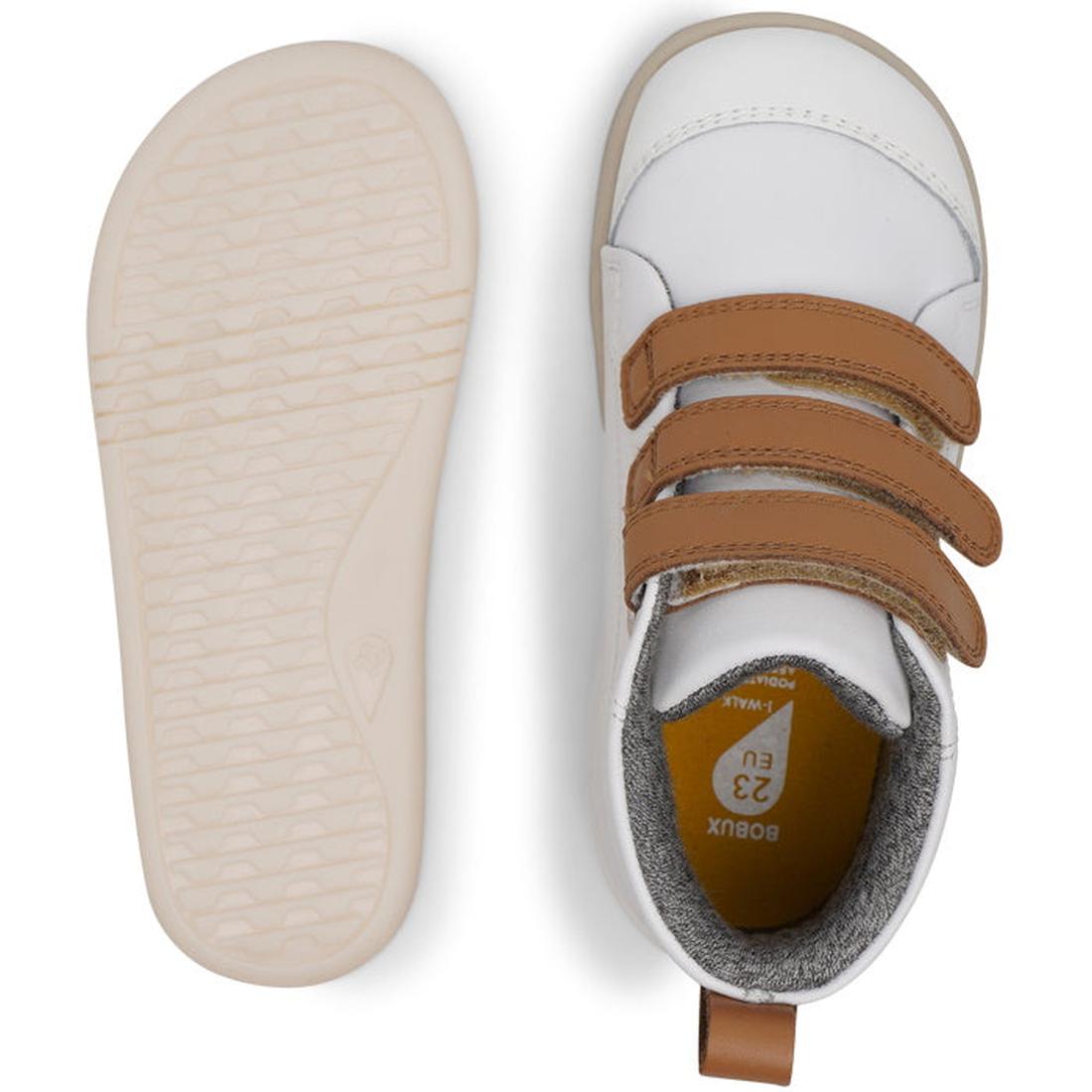The Bobux IWalk IW Hi Court Boot White Caramel Clearance toddler shoes feature brown double velcro straps, premium coated leather in white, tan caramel accents, and a textured beige sole. One shoe is shown from the top, one from the bottom., 9420071319701