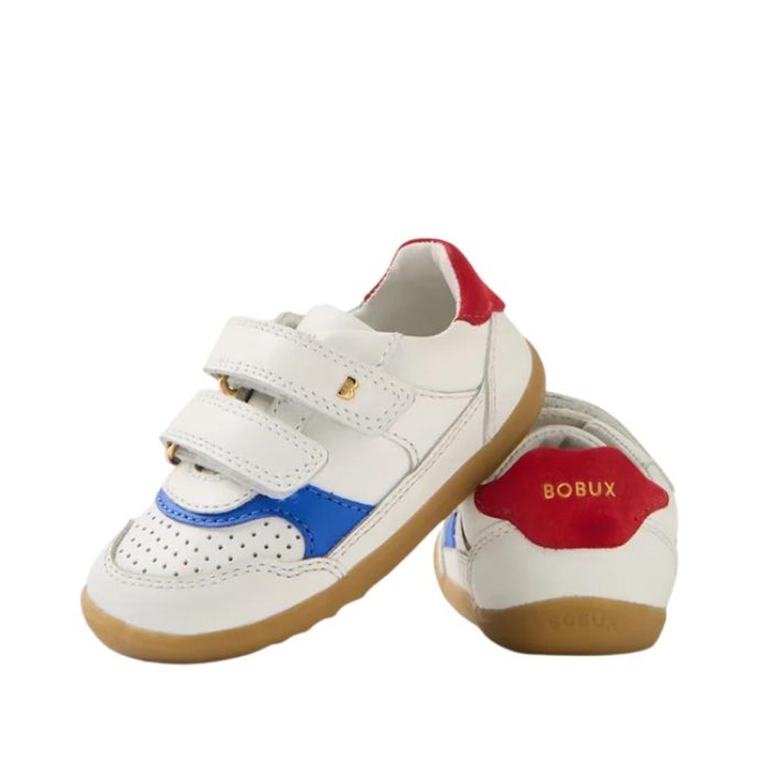 The Bobux IW Iwalk Hunter Leather Sneaker White Salsa is a kids' white leather sneaker with blue and red accents, brown rubber soles, two velcro straps, and a red heel featuring the BOBUX brand name in gold., 9420074834232, 9420074834249, 9420074834256, 9