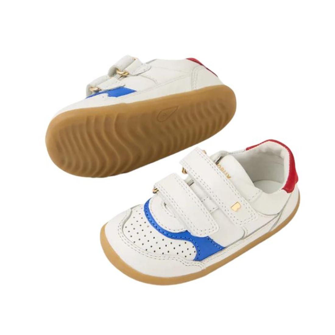 Two Bobux IW Iwalk Hunter Leather Sneaker White Salsa kids' shoes, featuring gum soles, blue and red accents, and double velcro straps. One shoe stands upright; the other lies sideways to display the sole and Quickdry leather finish., 9420074834232, 94200