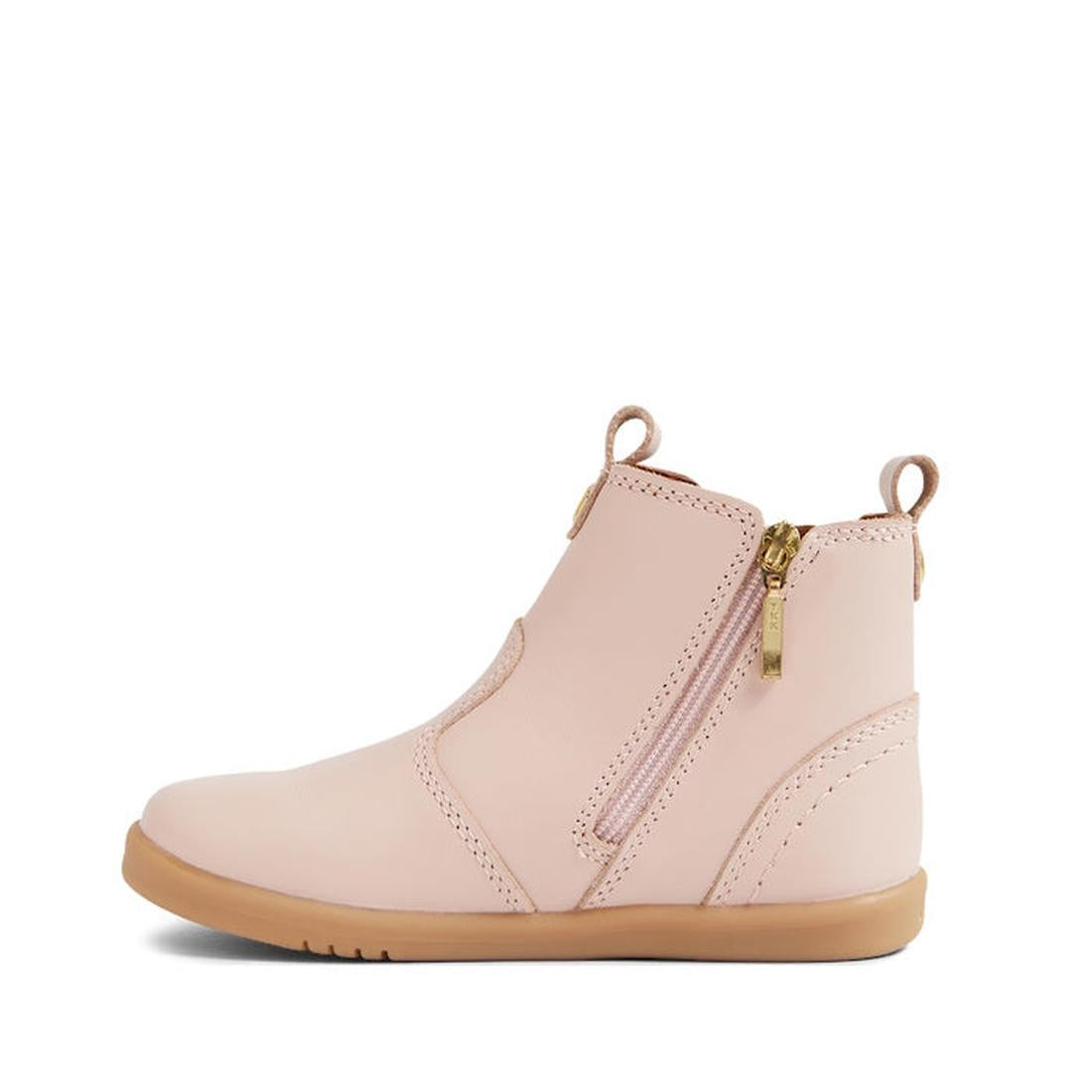 The Bobux IW Iwalk Jodhpur Leather Boot in Cameo Rose Pink features a light pink leather upper, tan rubber sole, gold side zipper, front and heel pull tabs, minimal stitching, a smooth finish, and is podiatrist endorsed for toddlers., 9420068539617, 94200