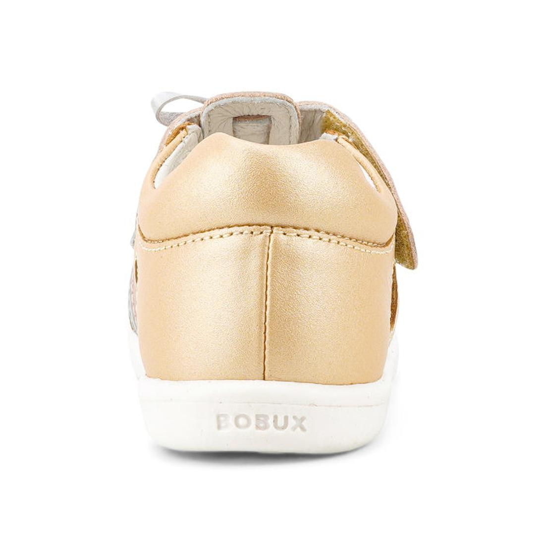 The Bobux IW Iwalk Mirror Pale Gold 633433 is a girls' open-toed sandal in shiny pale gold with a Velcro strap, premium leather, and the BOBUX brand embossed on the white sole—delivering comfort and style., 9420068524088, 9420068524095, 9420068524101, 942