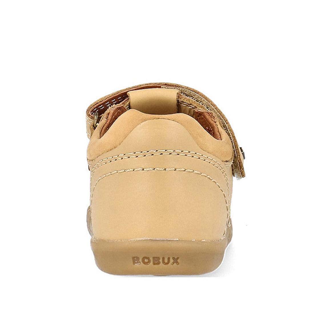 A Bobux IWalk Roam Sandal Parchment Beige Closed Toe 626030 for toddlers, seen from the back, shows visible stitching, a Velcro strap, and "BOBUX" embossed on the heel., 9420075781610, 9420075782907, 9420075780408, 9420075782662, 9420075782785