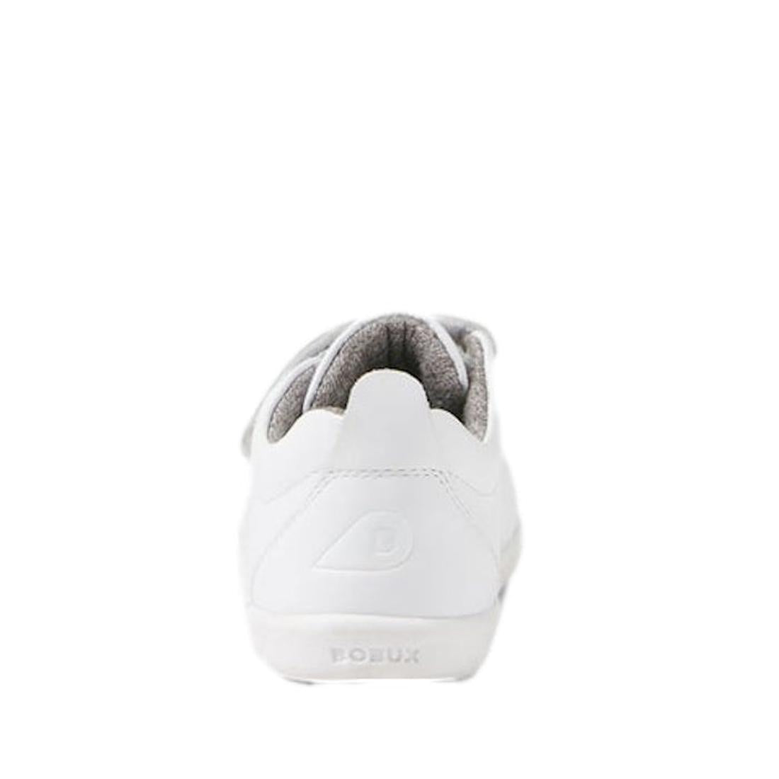 The Bobux - Iwalk Grass Court Sneaker Optical White 640510 is a white leather kids' sneaker seen from the back, featuring an embossed “B” logo on the heel, double velcro straps, gray inner lining, and “BOBUX” embossed on the sole., 9420068518094, 94200757