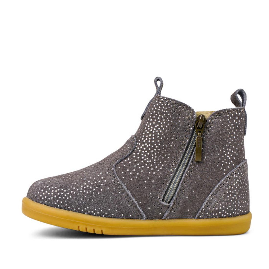 The Bobux Iwalk Jodphur Boot Charcoal Starburst 620857 Clearance is a child's ankle-high gray suede unisex boot with a side zipper, silver glitter dots, heel loop, and flat yellow rubber sole, shown in profile on a white background., 9420071309801, 942007