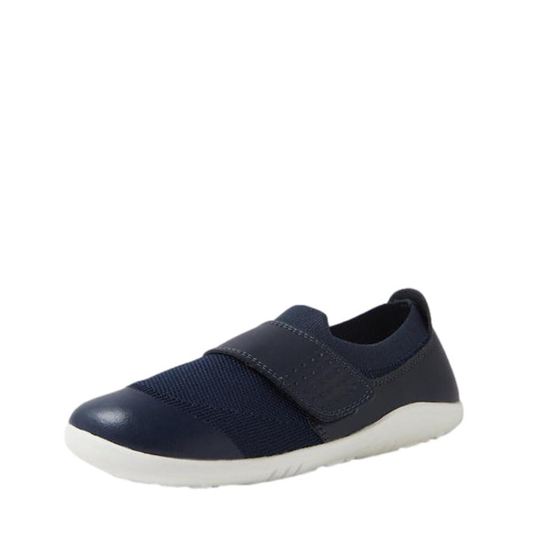 A single Bobux Kid+ Lo Dimension III Navy (838610 CLEARANCE) kids shoe with a white sole and wide Velcro strap, shown against a plain white background., 9420068533202, 9420068533219, 9420068533226, 9420071317882, 9420068533240, 9420068533257, 942006853326