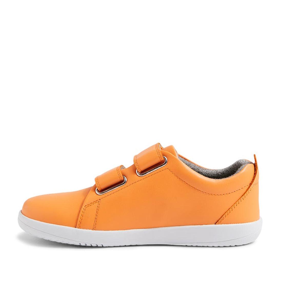 The Bobux KP Kid Plus Grass Court Apricot Crush 841009 is an orange kids’ trainer with a leather upper, double velcro straps, and a white rubber sole, shown in side profile on a plain white background., 9420075776265, 9420075777644, 9420075772717, 9420075