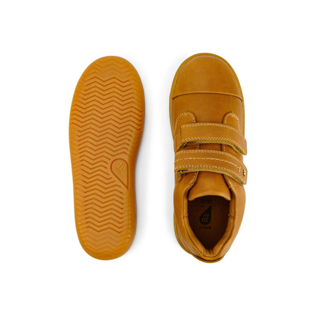 Top view of the Bobux Kid+ Port Shoe Caramel Tan 833002, a kids’ leather shoe with two velcro straps and a gum sole, shown next to its textured, grippy sole., 9420068525467, 9420068525474, 9420068525481, 9420068525498, 9420029755704, 9420029755674, 942002